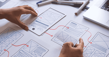 Designer Creating Paper Wireframe - Hero